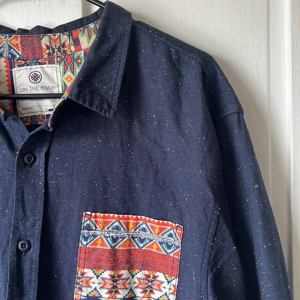 Men’s XL button up polo, dark blue with Aztec pattern.
